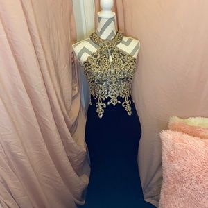 I am selling a navy blue and gold prom dress